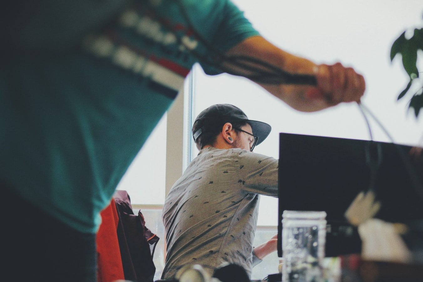 Two roommates preparing their apartment - make sure to know which things to discuss before moving in with a roommate