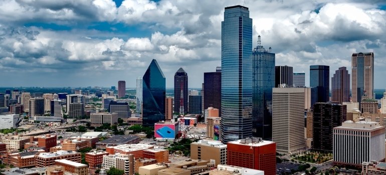 City of Dallas under white clouds