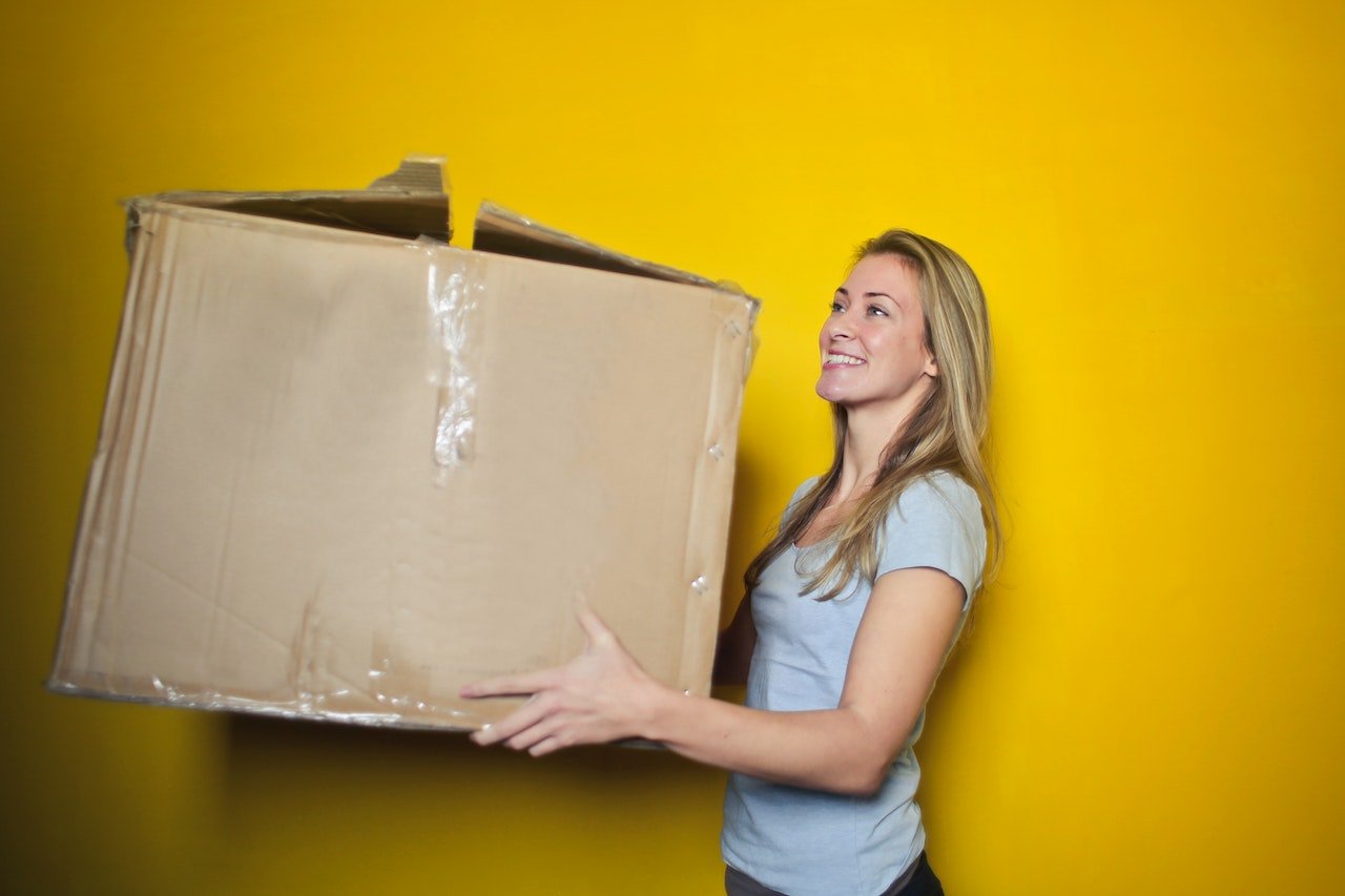 Girl holding a big box