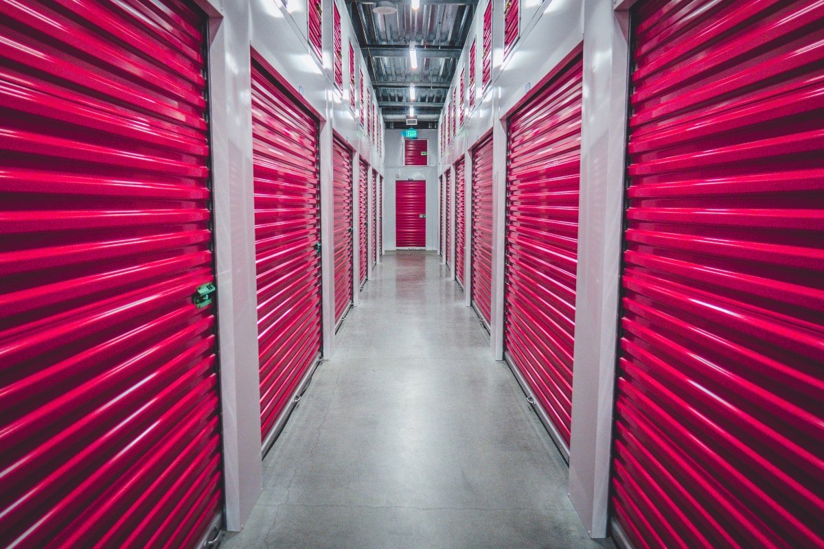 Interior storage with pink doors of several units