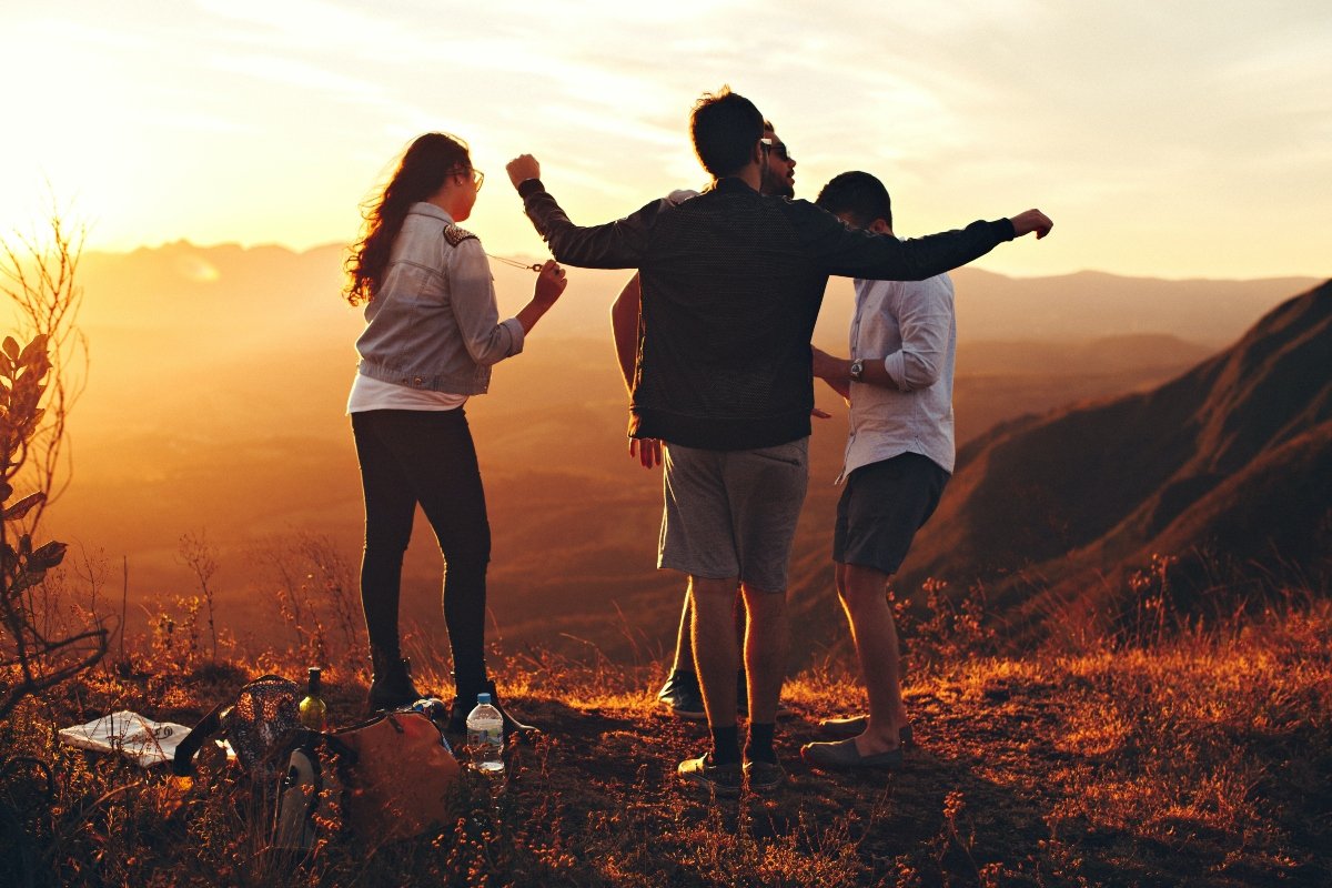 Family on the hill during sunset talking about the things you should know before moving to Gilroy with kids