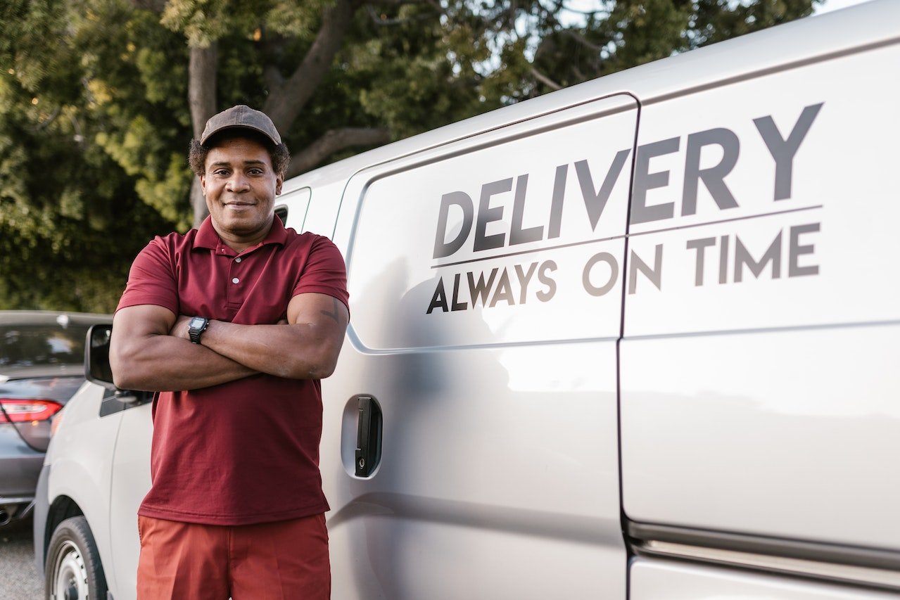 a man in front of a white van