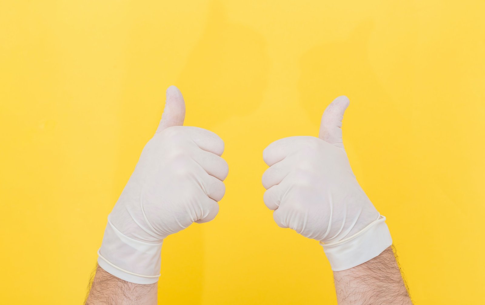 Picture of a person wearing white gloves