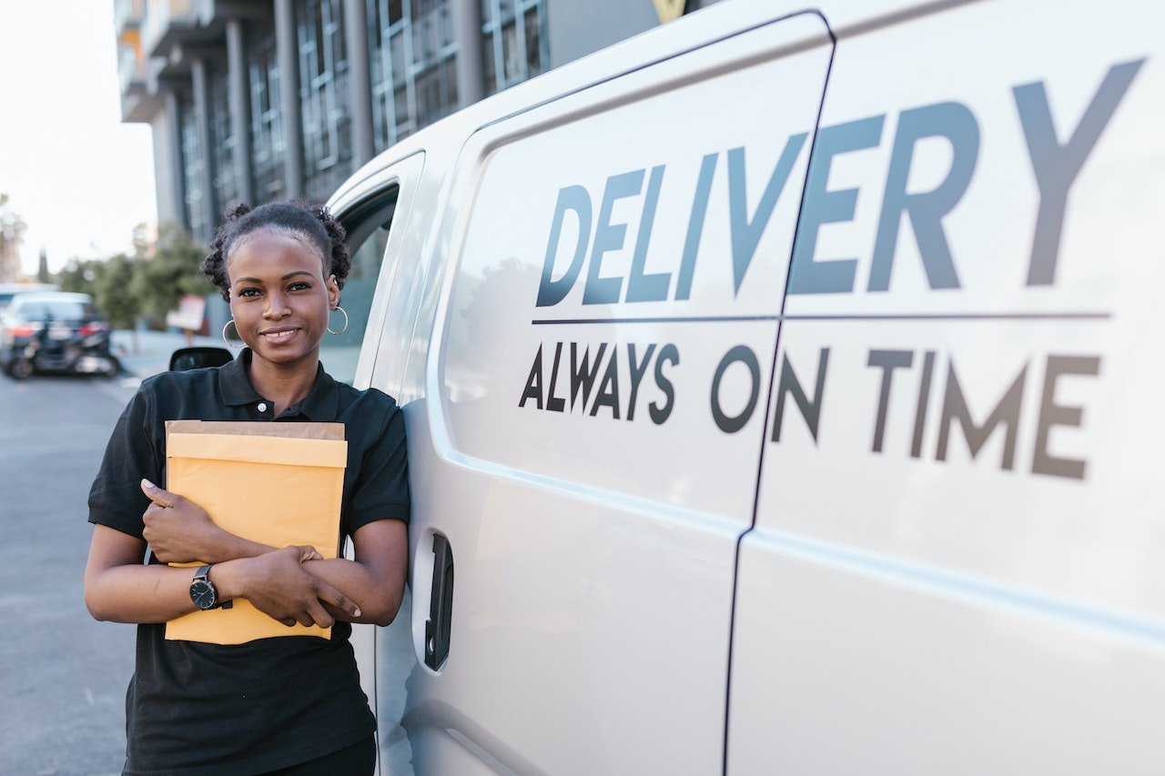 Delivery woman holding a parcel
