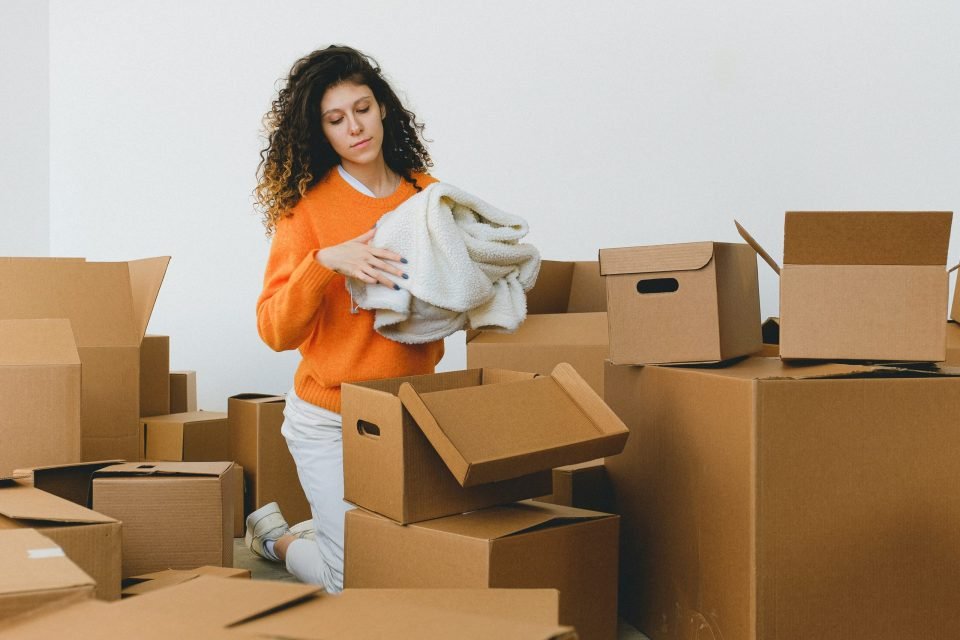 Woman packing items into boxes