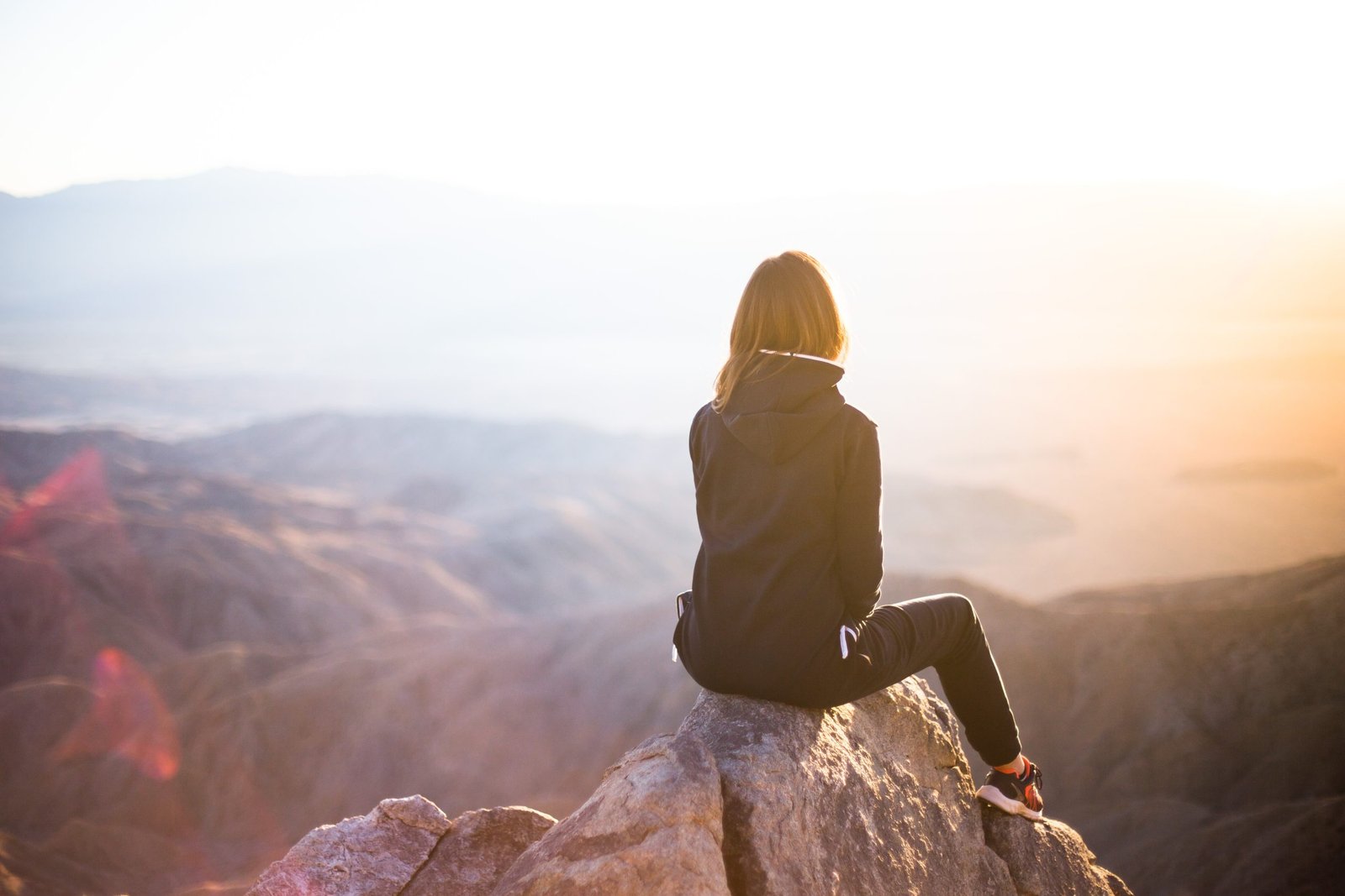 woman gazing into the distant mountains