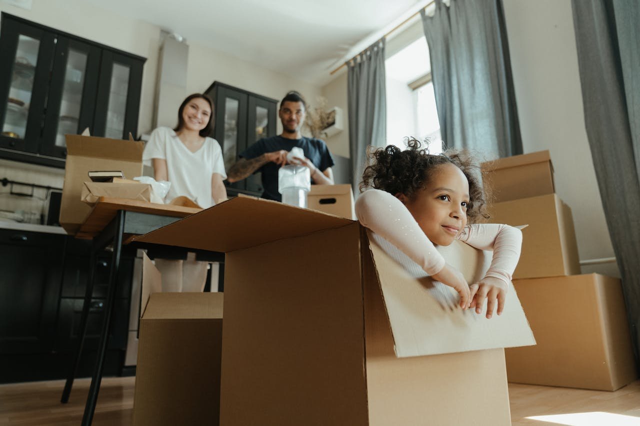 A girl sitting in a box