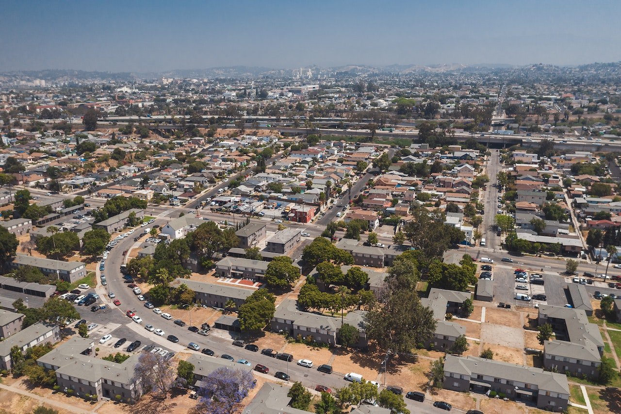 Aerial view of a neighborhood in California announcing a newcomer's guide to exploring Gilroy.