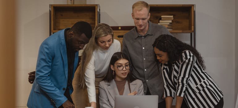 colleagues looking at the laptop