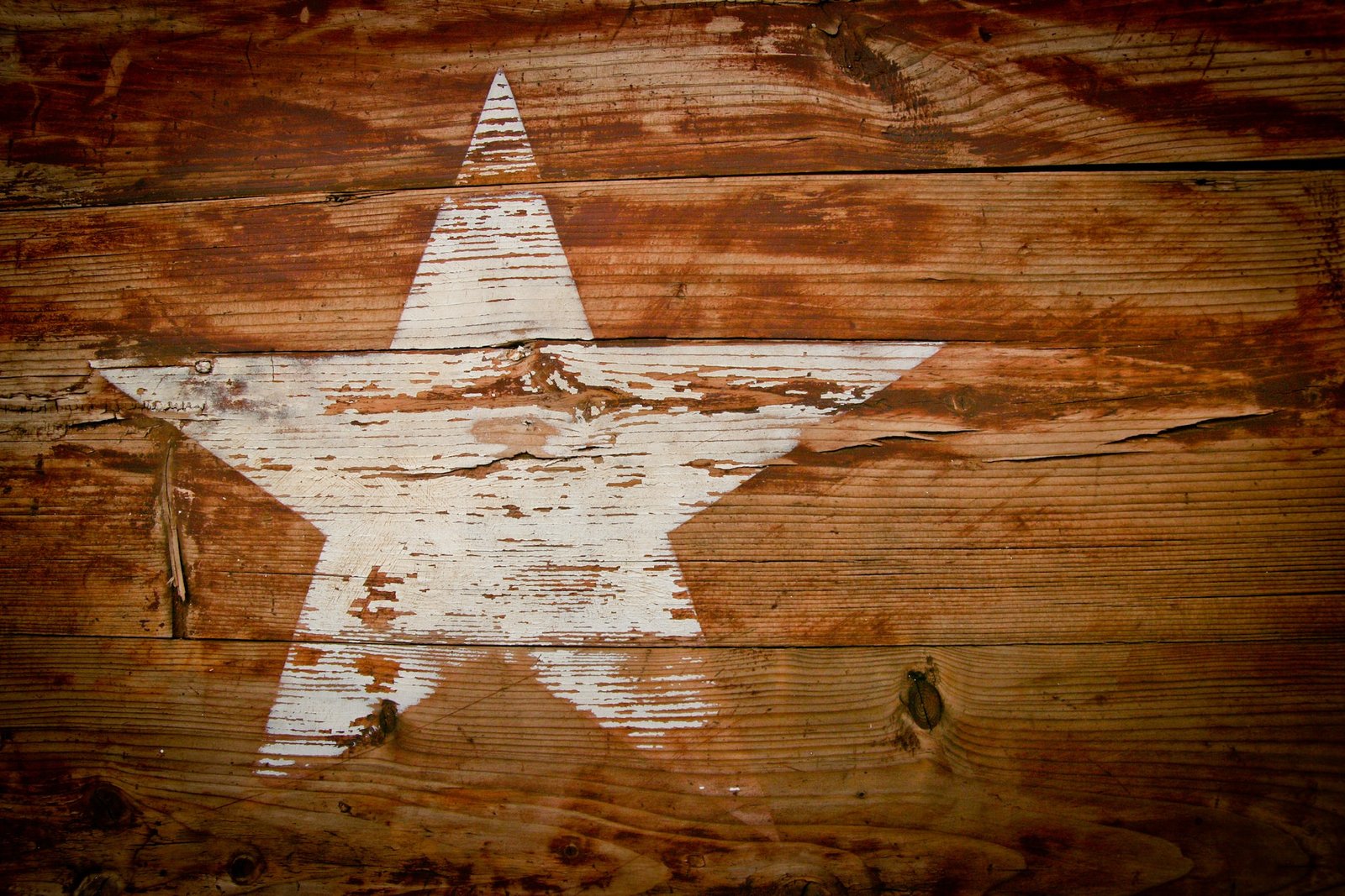 Picture of a painted star on a wooden background