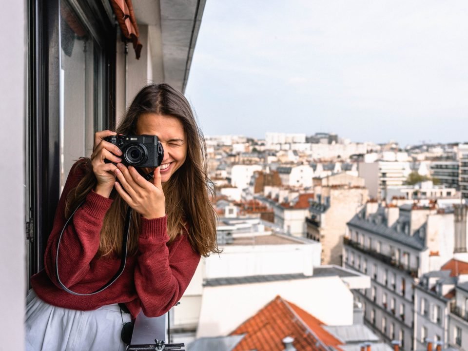 A young woman using her camera