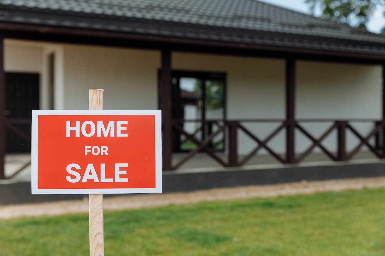 Picture of a red sign in front of a house