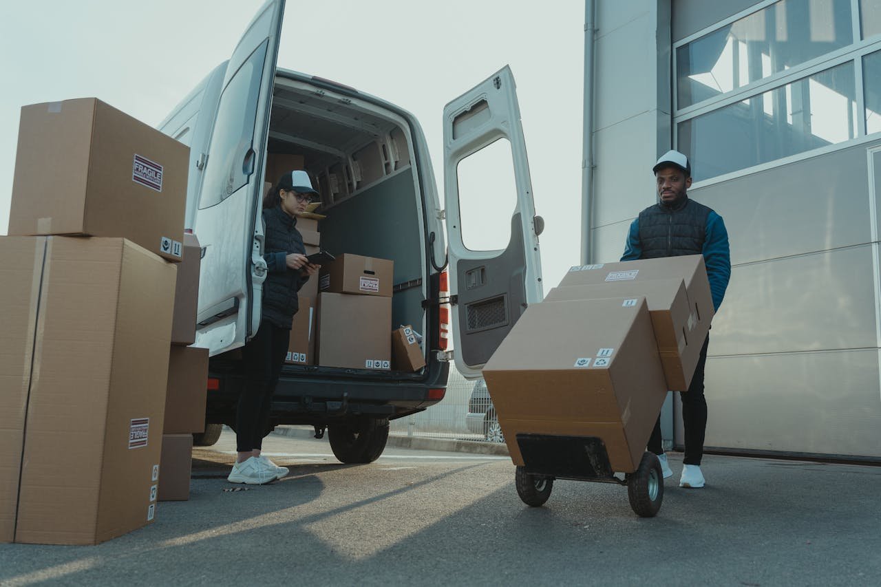 A man and woman working for a delivery company.