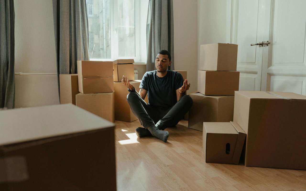 a man with moving boxes