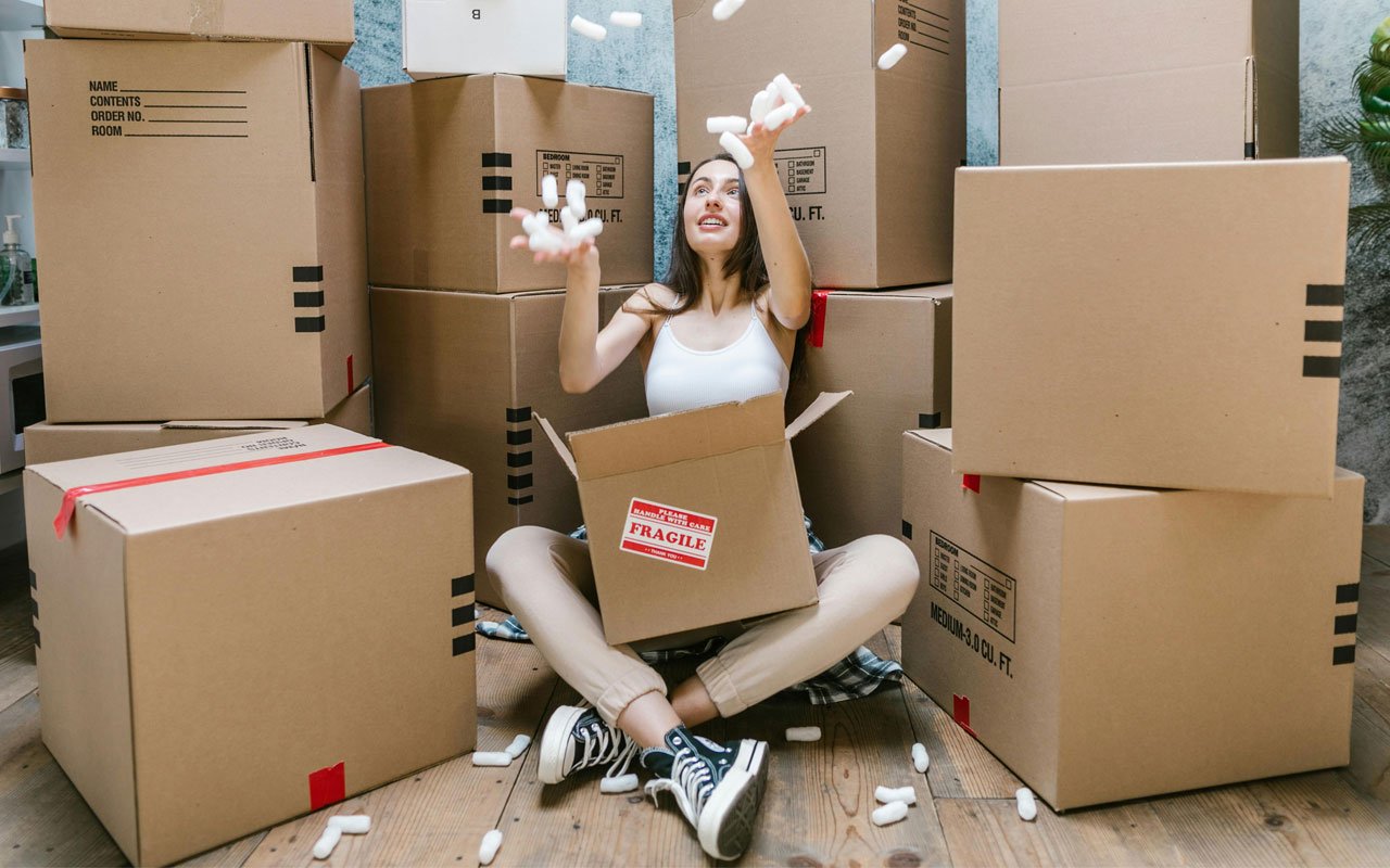 a woman with moving boxes