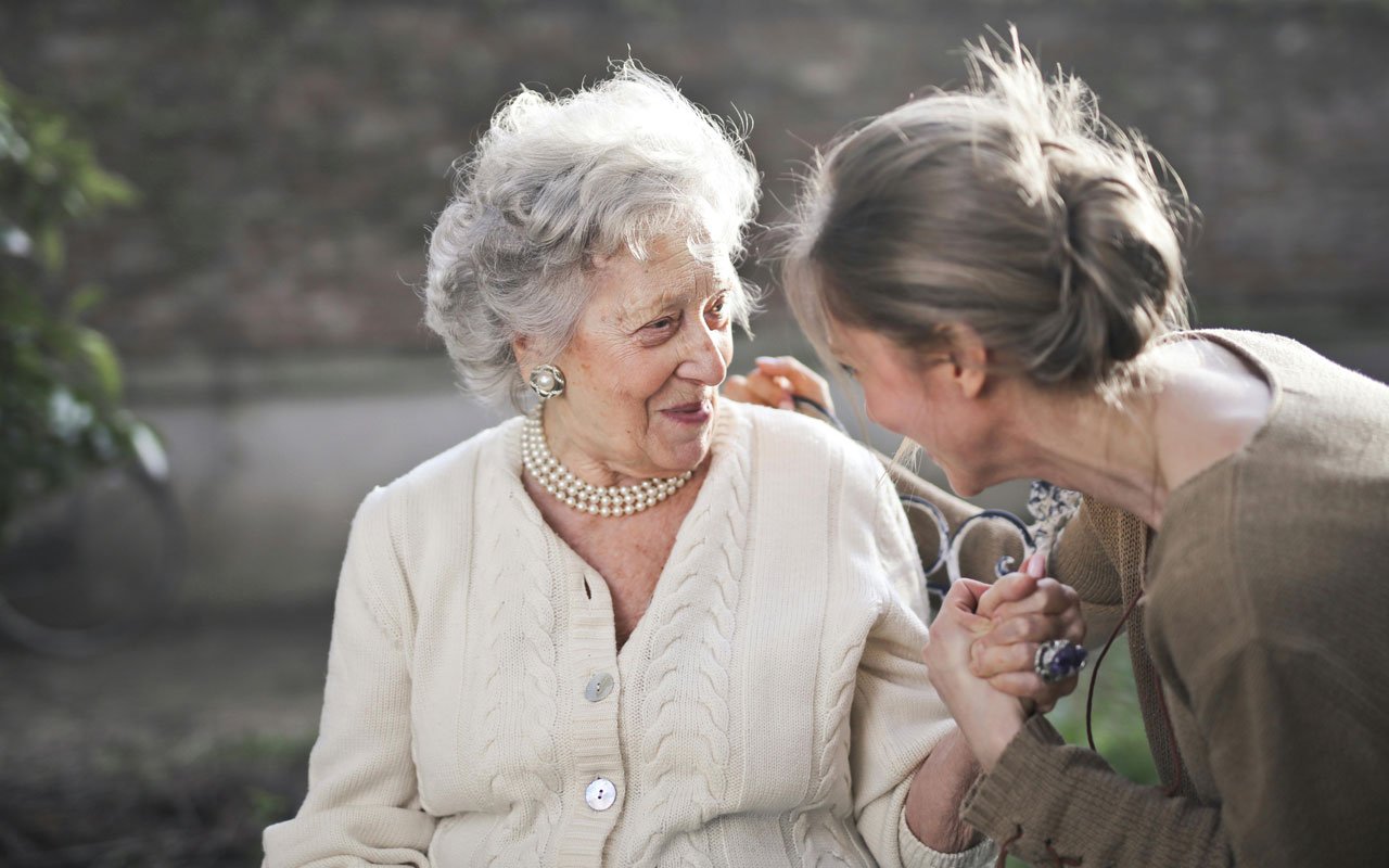 an older lady with her daughter